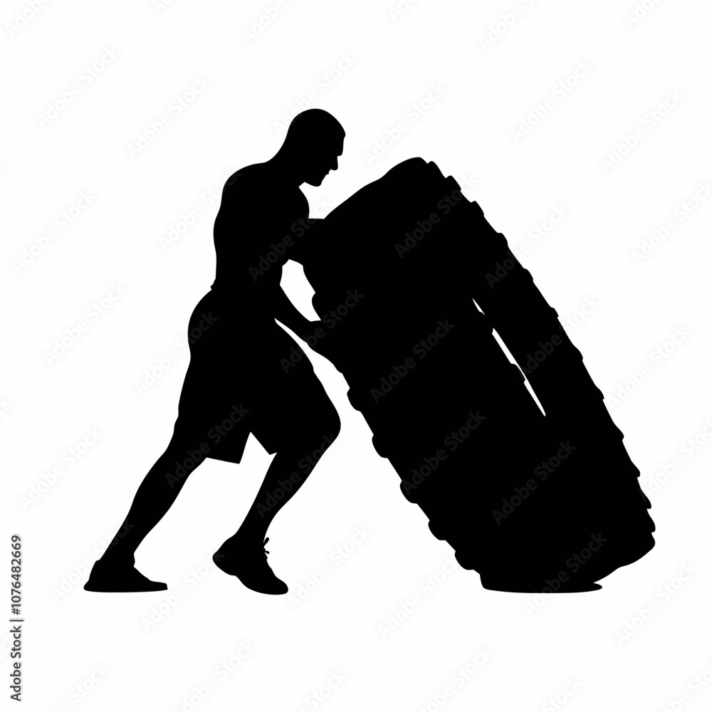 A man is pushing a tire. The tire is black and white. The man is wearing shorts