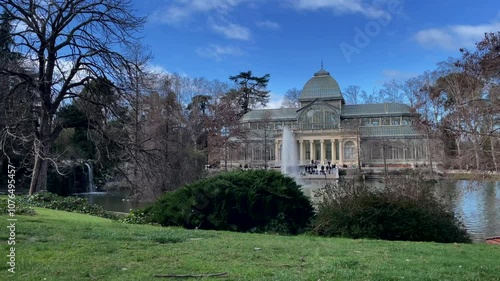 Wallpaper Mural Madrid, Spain - February 23, 2023, Timelapse of Palacio de Cristal , Glass Palace, in Buen Retiro Park in Madrid, Spain. High quality video Torontodigital.ca