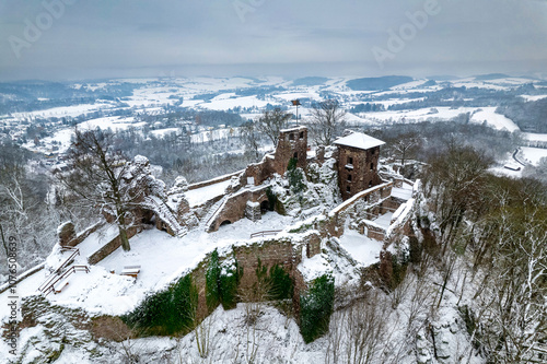 Aerial view ruins of old castle. Winter. Ruin of Hohnstein Castle, Harz mountains, Germany.