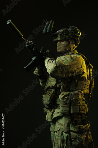 Side Profile of Soldier in Tactical Gear Loading Rifle Magazine