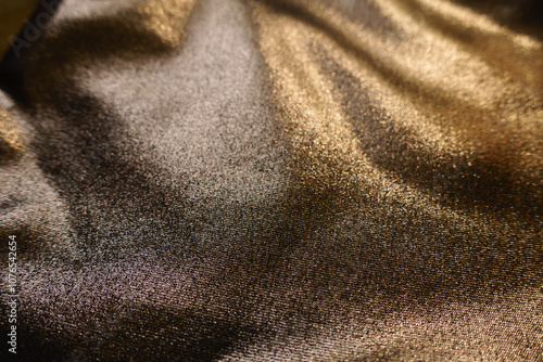 Slika na platnu Macro of shiny bronze nylon and spandex lame fabric