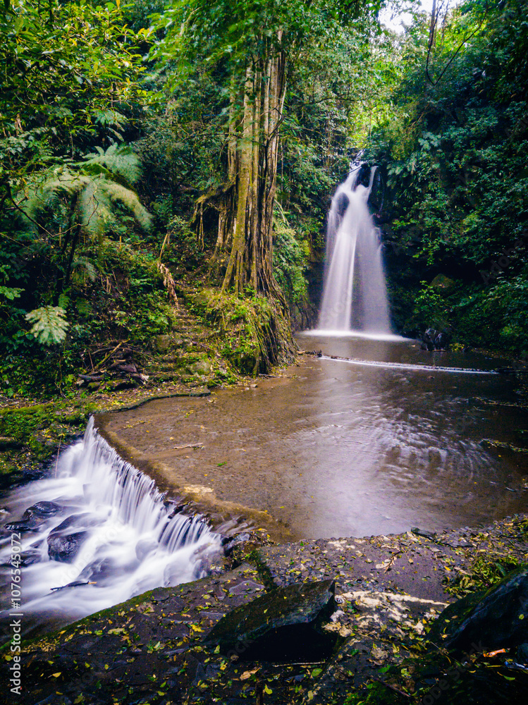 Obraz premium the figure of a beautiful princess depicted by a waterfall. One of the hidden gems in Kuningan.