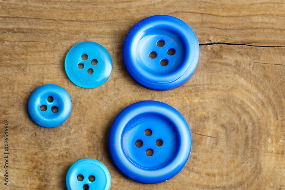 Button on wooden in blue. design equipment object concept. a button lies on a wooden in bright blue. a button lies on a wooden lifestyle in bright blue. Button on wooden in blue. design equipment object concept. a button lies on a wooden in bright blue. a button lies on a wooden lifestyle in bright blue.