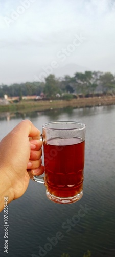 Enjoy a glass of warm tea with a beautiful river background