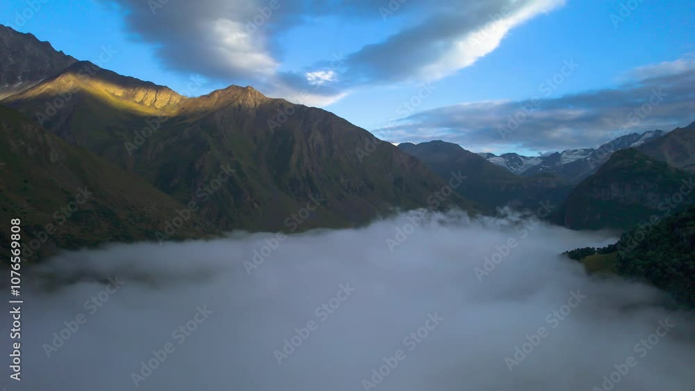 High mountains above the clouds, low clouds in the North Caucasus mountains High mountains above the clouds, low clouds in the North Caucasus mountains