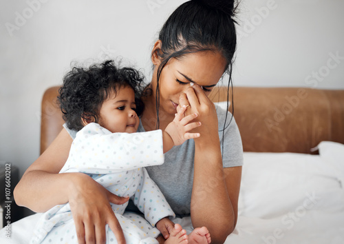 Mother, baby and stress with headache, burnout and postpartum depression as parenting in home. Female person, childcare and tired with fatigue, frustrated and anxiety for mental health or wellness photo