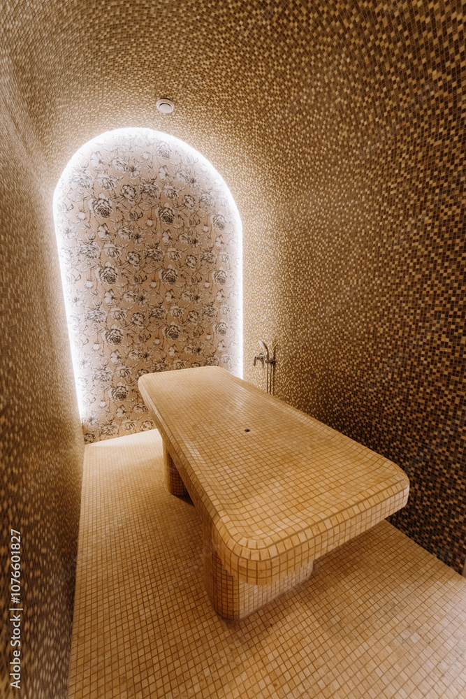 Obraz premium Luxurious spa steam room with tiled massage table and ambient lighting for ultimate relaxation
