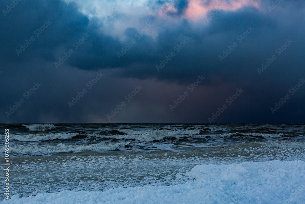 Fototapeta premium Wonderfully beautiful sunset by the sea in winter with ice