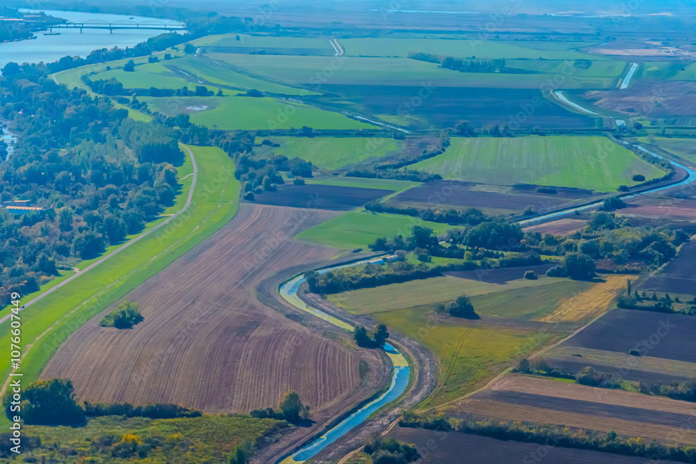 Aerial view of valley with farm fields, pond and Danube river. High quality photo Aerial view of valley with farm fields, pond and Danube river. High quality photo