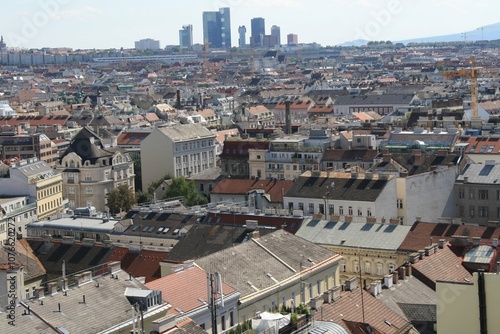 Photography Panoramic view of Vienna's historic rooftops with modern skyscrapers in the back