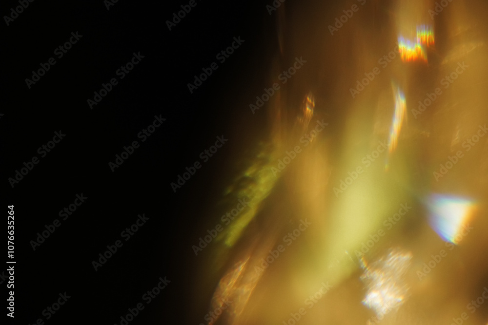 Fototapeta premium Prismatic Luxury Gold Overlays – High-resolution abstract light and golden bokeh textures. Perfect for adding an elegant, prismatic glow to photos, invitations, and branding with a luxurious touch.