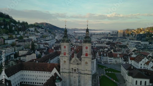 Aerial footage of Abbey of St Gall and old town of St Gallen at sunrise. The Abbey of Saint Gall is a dissolved abbey in a Catholic religious complex in the city of St. Gallen in Switzerland.