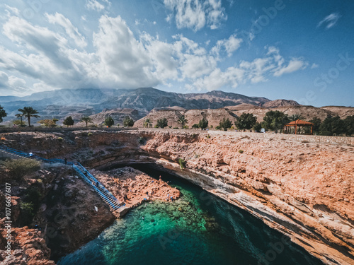 Bimmah, Oman, Bimmah Sinkhole in Oman, where fresh and salt water combine. Beautiful turquoise blue splendor. 600 meters separate the northeast coast of Oman. People spimming and realaxing.