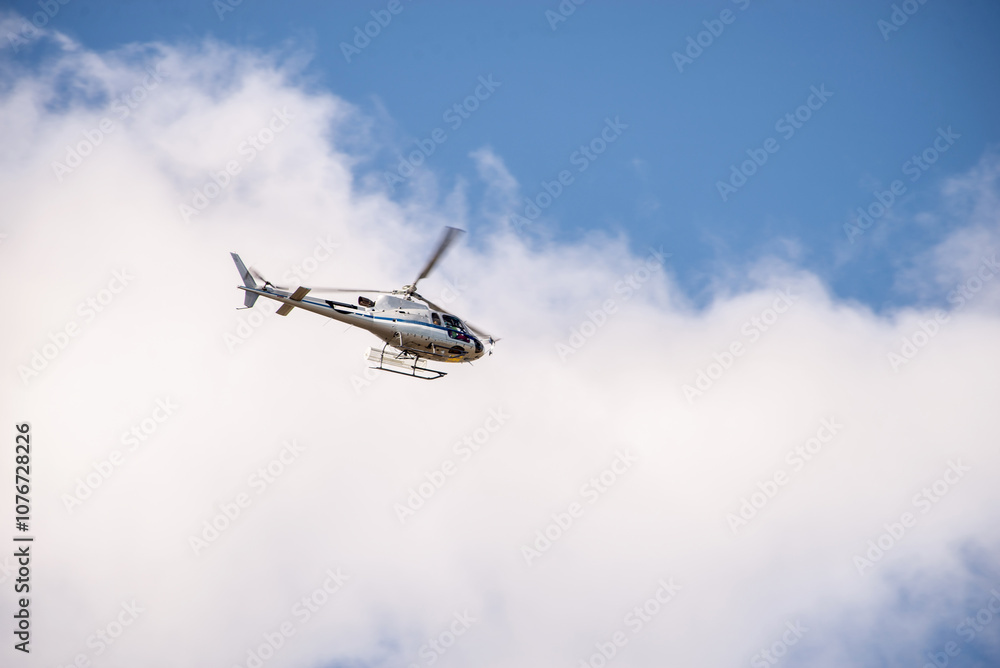 A helicopter flies in the sky to eliminate the consequences of natural disasters. Rescue services. A helicopter flies in the sky to eliminate the consequences of natural disasters. Rescue services.