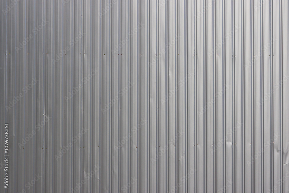 A wall with a silver metal strip on it. A wall with a silver metal strip on it.