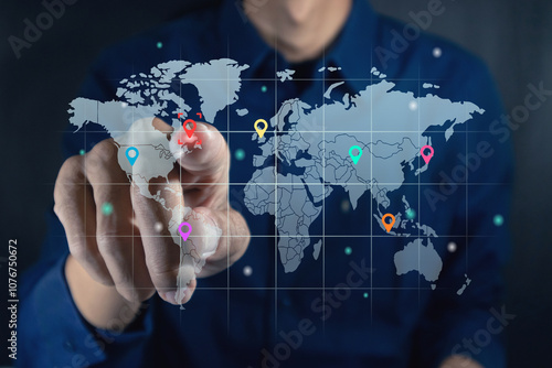 Man touching a virtual screen of world map infographic. World map infographic with color pointers.