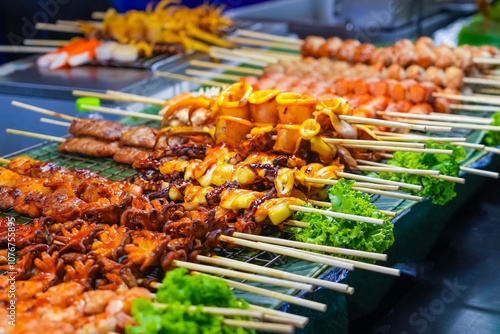Canvas Print Seafood octopus and other meat balls on a street food stall.