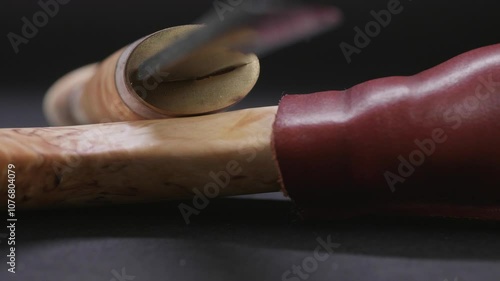 Studio shot of leather-sheathed Sami knife photo