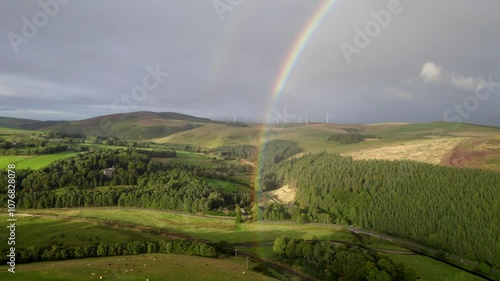 Scottish wind turbines and a rainbow by drone