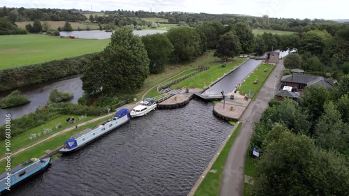 Running past Woodlesford Lock, River Aire, Leeds, UK