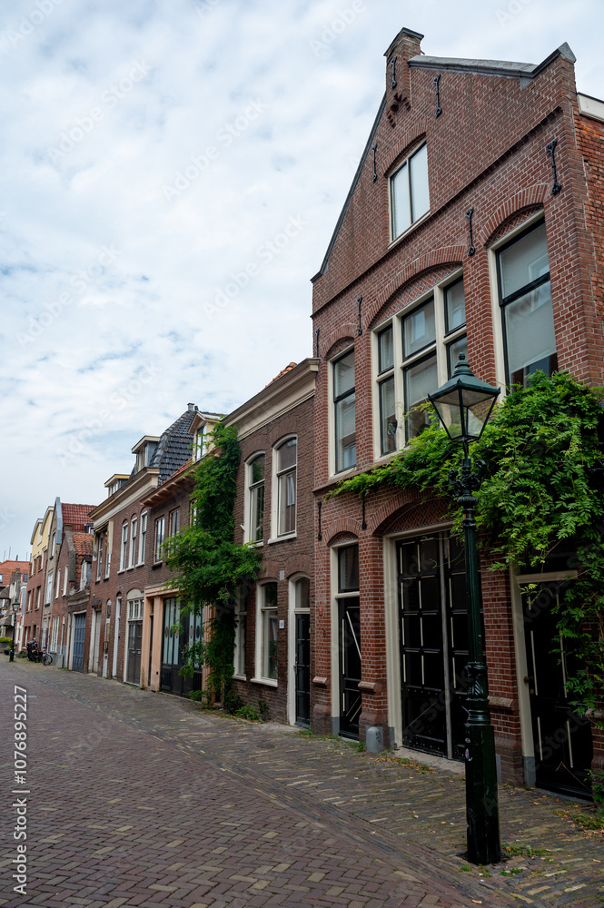 A street in the old town of Alkmaar in the Netherlands A street in the old town of Alkmaar in the Netherlands