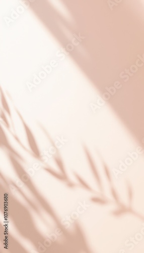 Shadowed silhouette of leaves on a warm peach-colored background