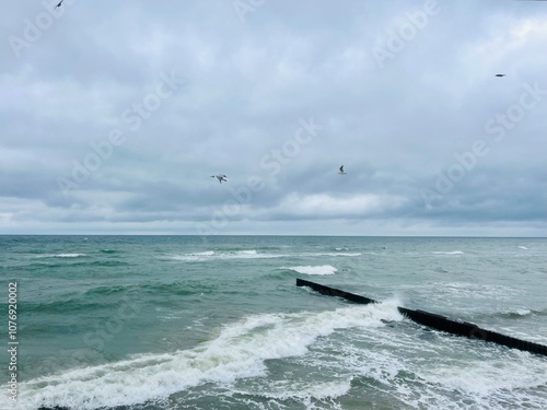 stormy cloudy seascape, waves at the sea, rainy clouds