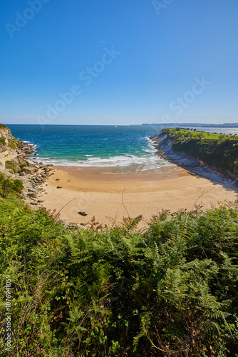 Sunny day on a Matalenas Beach in Santader, Spain photo