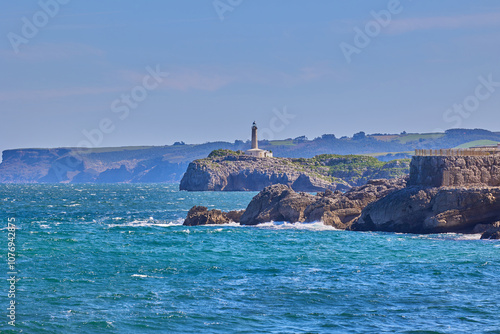 Mouro Island Lighthouse on the rocky island in Santander photo