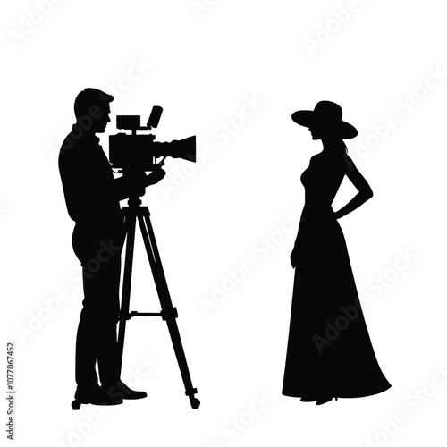 A silhouette of a cameraman operating a standing camera on a tripod,