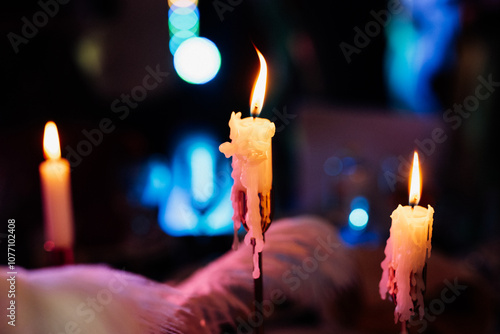 White candle on brown stick photo