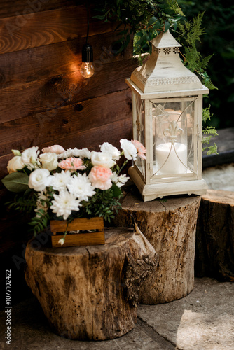 White candle lantern on white wooden table photo