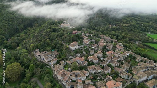 Mirmande, France - 1 November 2024: Panoramic view of the prettiest small towns in France - Mirmande with morning fog. In the south of France in the Rhones Alpes - Drome area photo