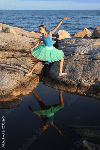 Dancer in blue by the ocean