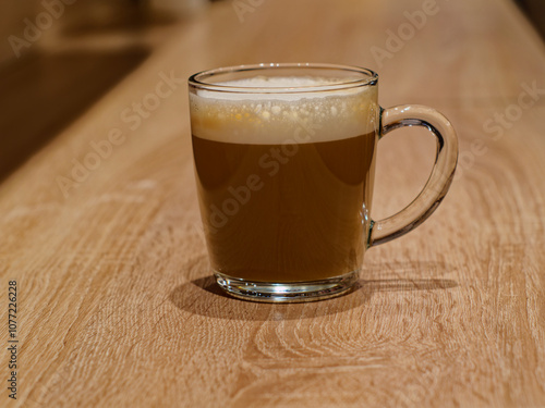 Glass cup of cappuccino
