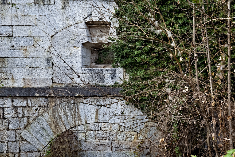 Tagliata della Scala: the facade of the nineteenth-century fortress with an artillery loophole. Primolano, Veneto, Italy.