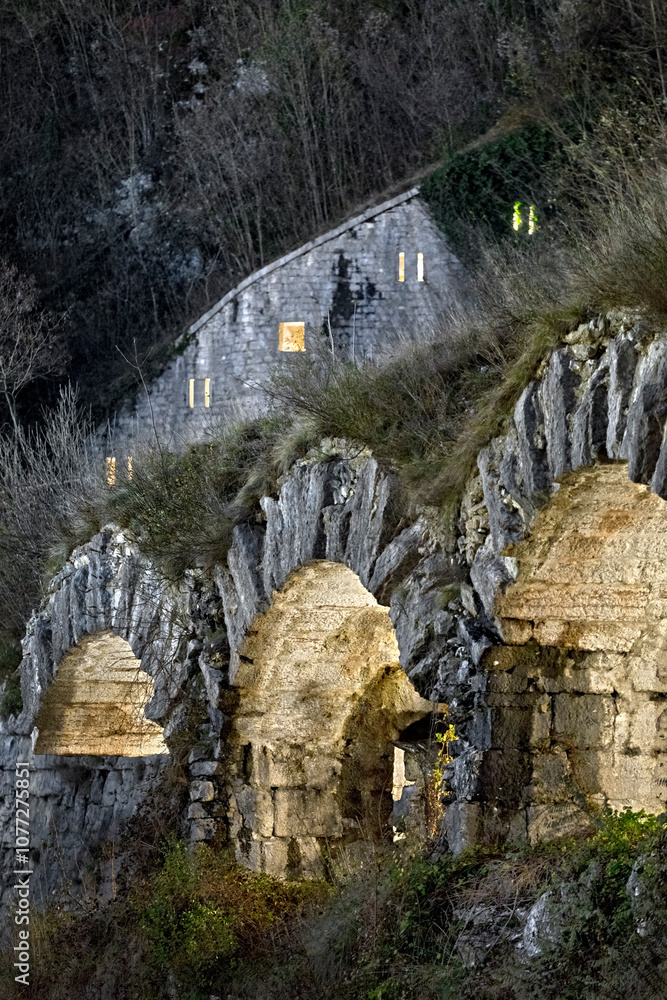 Tagliata della Scala: Illuminated arches of the 19th-century fortress. Primolano, Veneto, Italy.