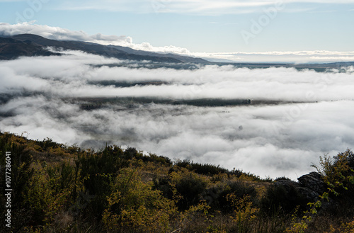 Low cloud fog covered mountains hills in Clyde New Zealand photo