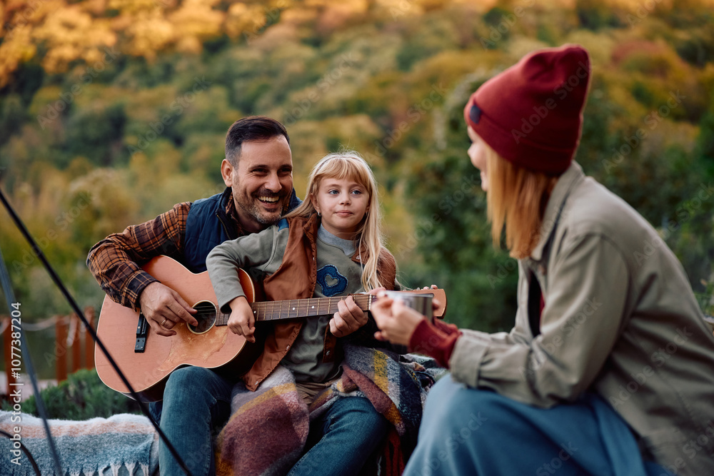 Happy family having fun while camping in nature in autumn. Happy family having fun while camping in nature in autumn.