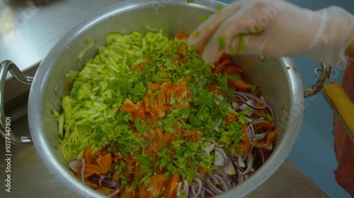 Putting a salad together in a professional kitchen