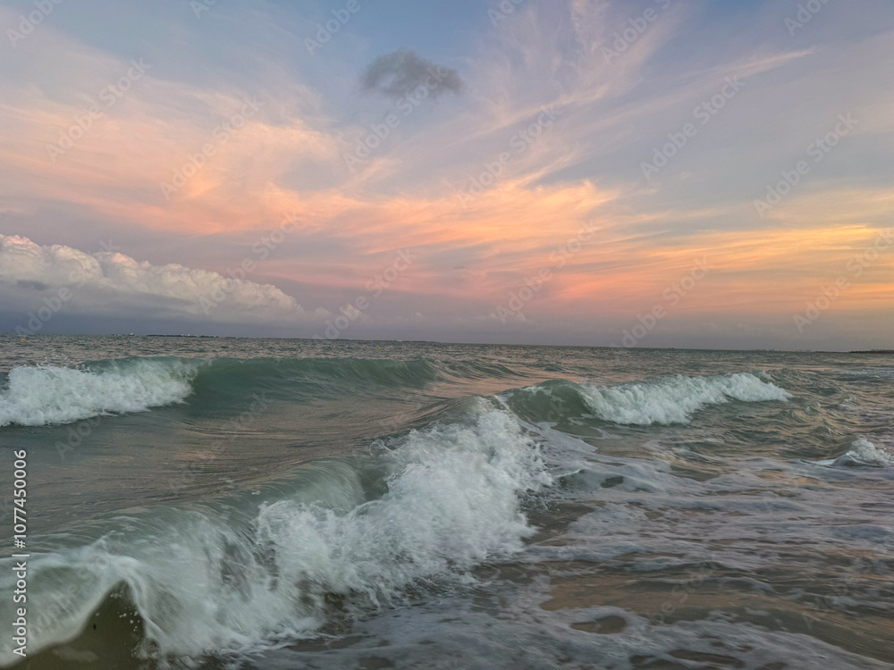 waves at the beach at sunset waves at the beach at sunset