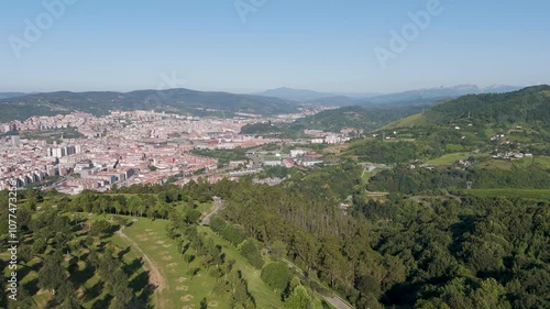 Aerial footage of Mount Cobetas with a view over Bilbao city in the province of Biscay, Spain photo