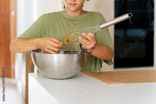 Mixing Ingredients in Kitchen photo