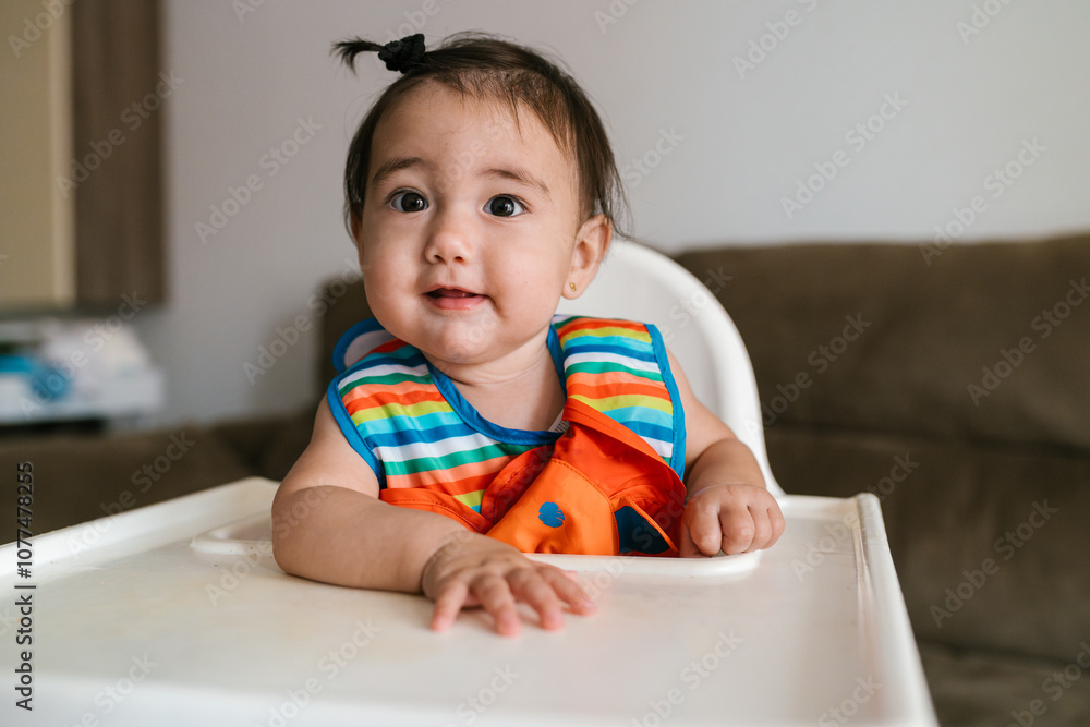 Happy baby smiling in high chair Happy baby smiling in high chair