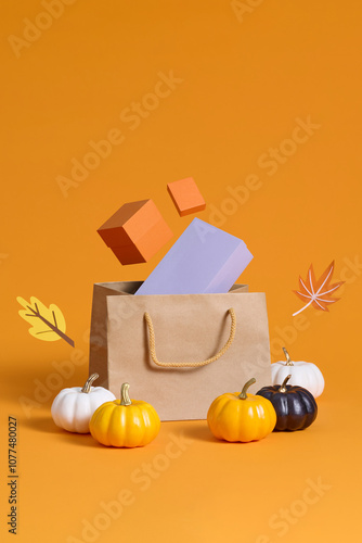 Colorful Halloween gift bags and boxes surrounded by pumpkins an photo