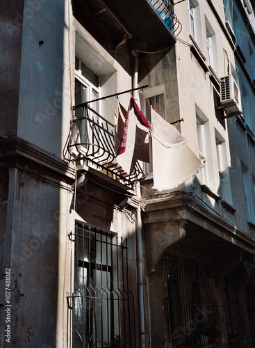 Washed rugs Hanging from Balcony photo