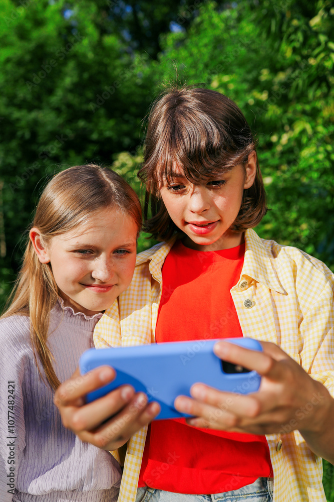 Two Girls Watching Video on Smartphone Two Girls Watching Video on Smartphone
