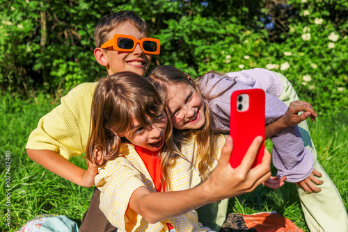 Kids Taking a Fun Selfie with Phone photo