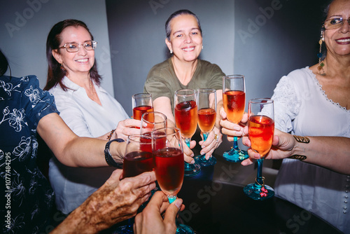 Group Toasting with Colorful Drinks photo