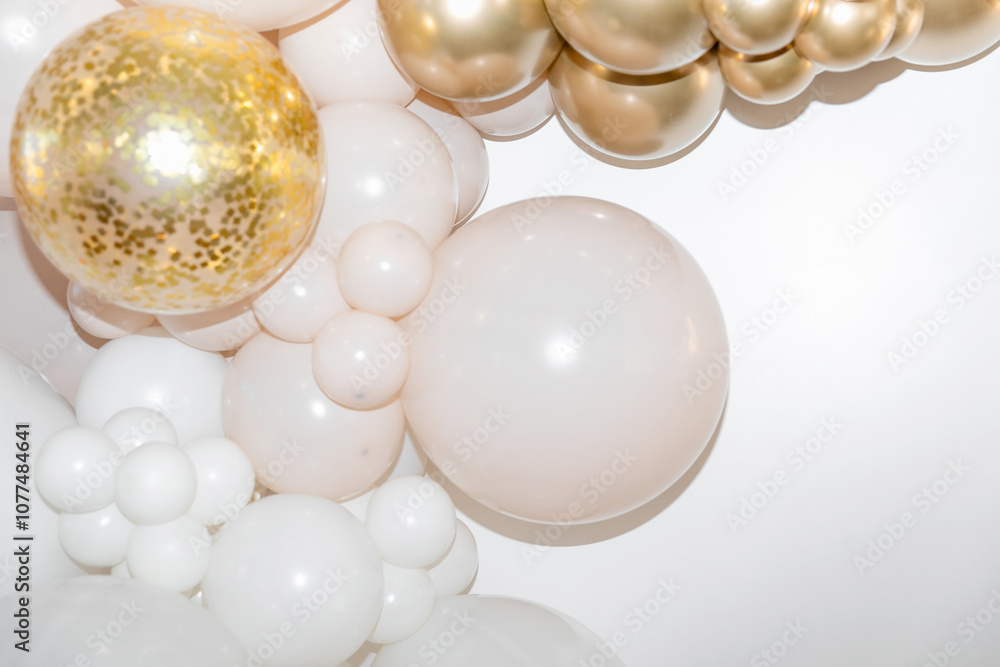 White and gold balloons with confetti on a white background are creating an elegant and festive atmosphere. Background. Festive background. White and gold balloons with confetti on a white background are creating an elegant and festive atmosphere. Background. Festive background.